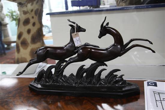 Lucien Charles Alliot (1877-1967) An Art Deco bronze group of two running gazelles, length 29in.